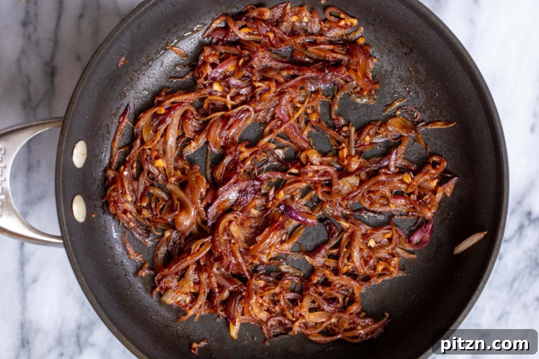 onions and tempered spices in a sauteeing pan