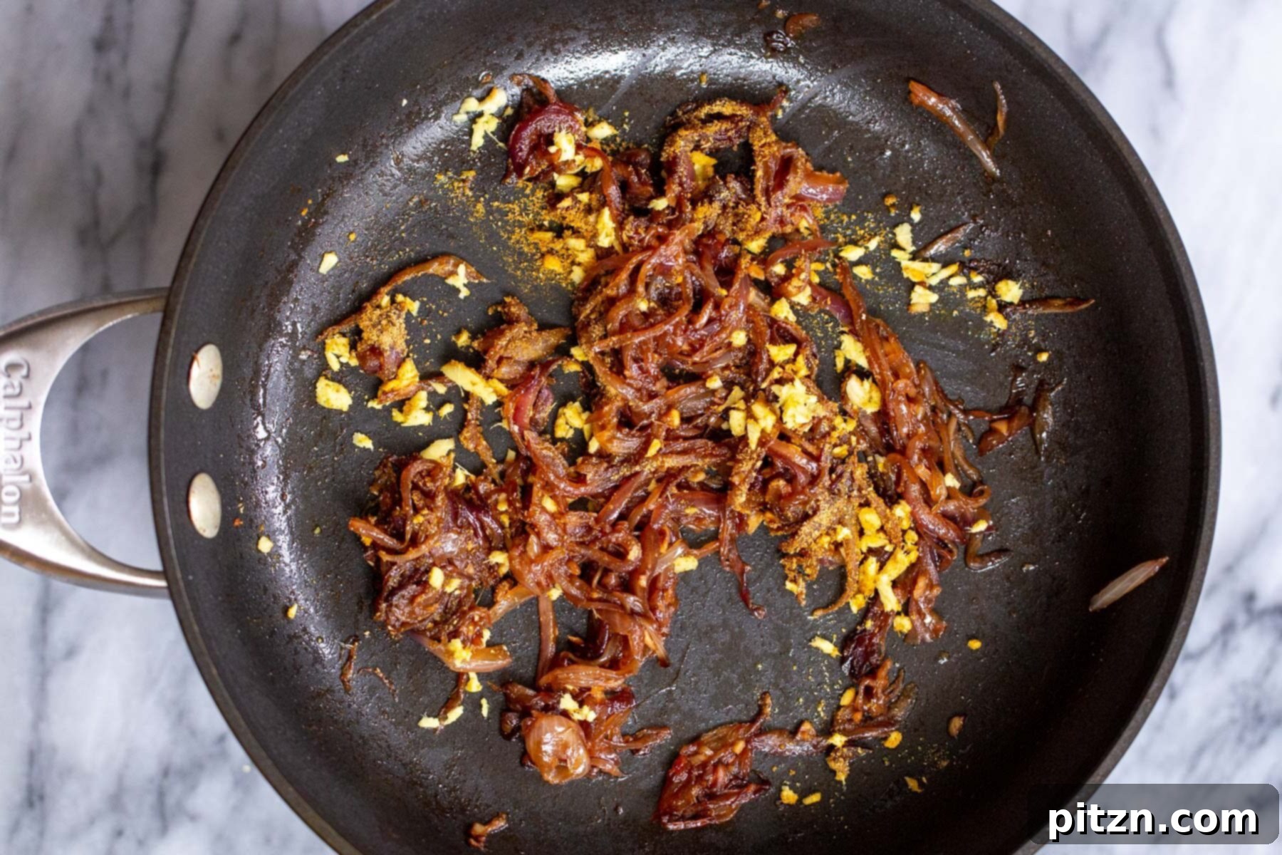 sauteed tempered onions and ginger in sauteeing pan