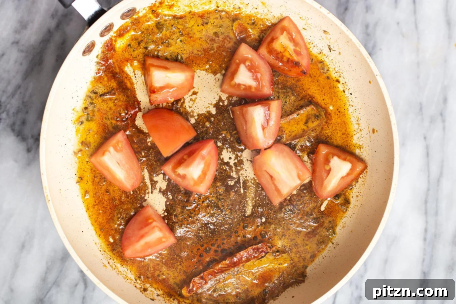 Creamy Plant-Based Dhaba Dal 14 Chopped tomatoes being added to a pan with the fragrant tempering mixture