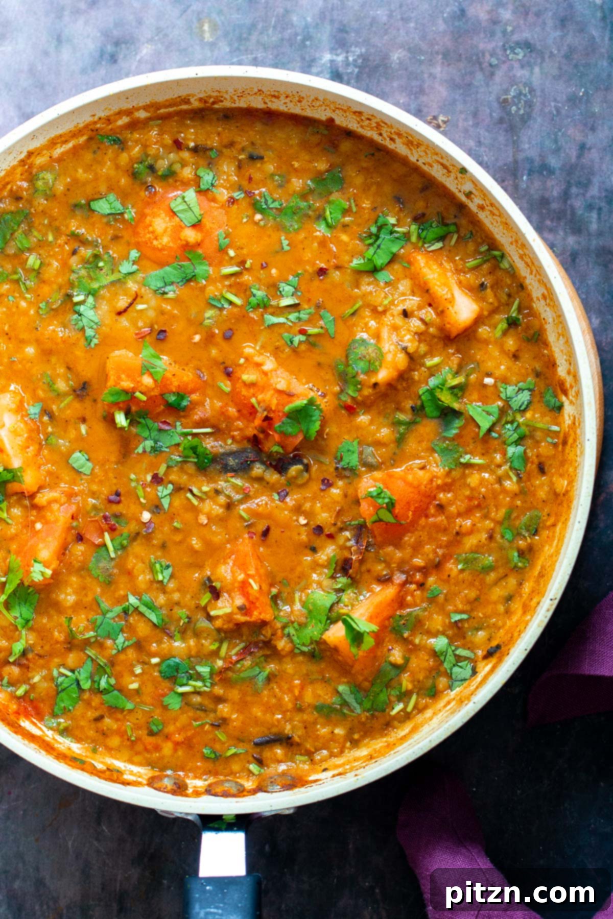 Creamy Plant-Based Dhaba Dal 6 A pan with vegan butter dal, garnished with fresh cilantro, ready to serve