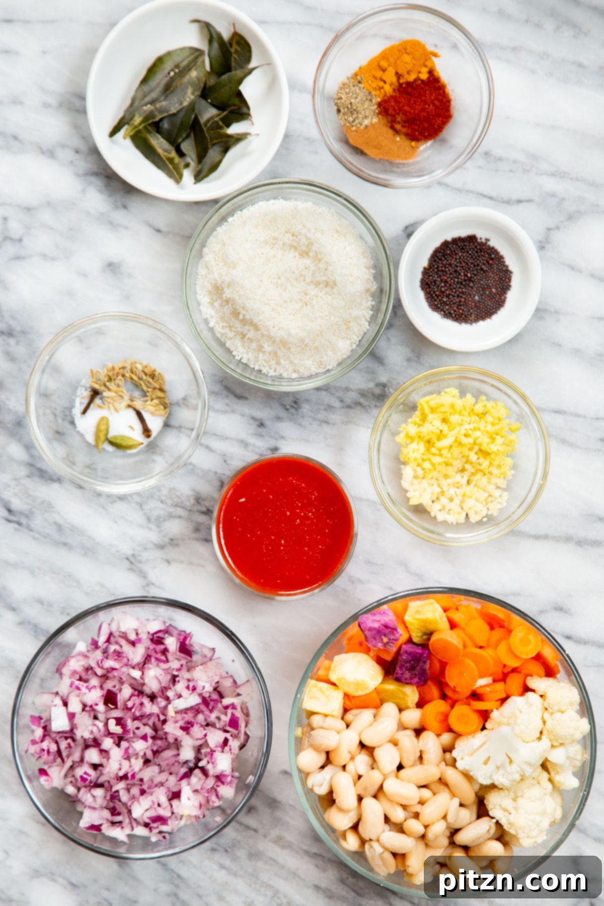 Hearty Vegan Malabar Curry 7 All the fresh ingredients laid out, ready for making vegan Malabar curry, including spices, vegetables, and coconut.