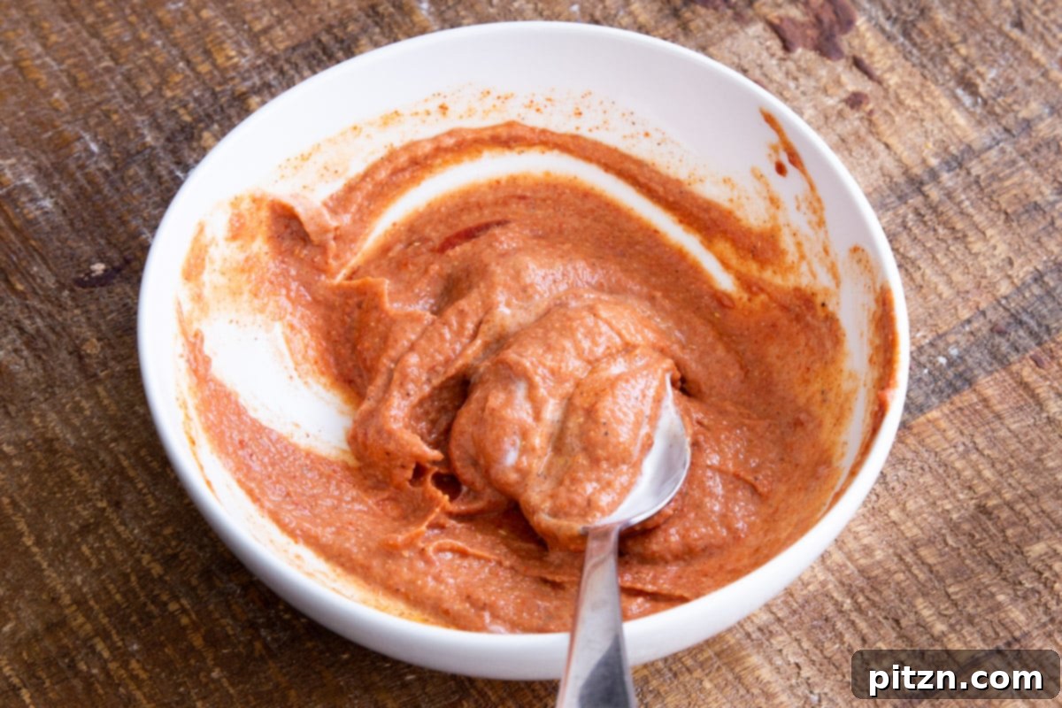 Fusion Tikka Pasta Salad 11 Indian spiced creamy tikka masala dressing in a small bowl