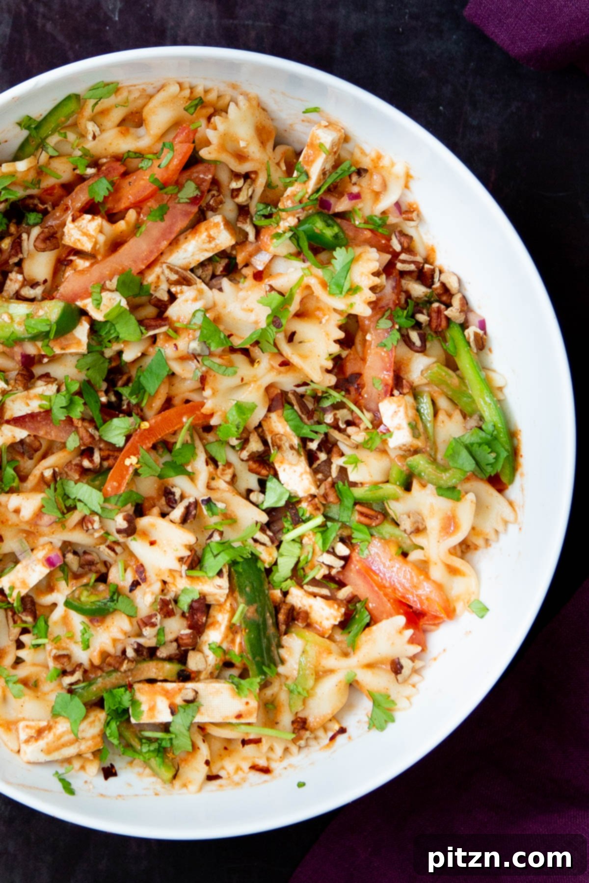 Fusion Tikka Pasta Salad 14 Creamy vegan Indian Tikka Masala pasta salad with veggies in a white bowl