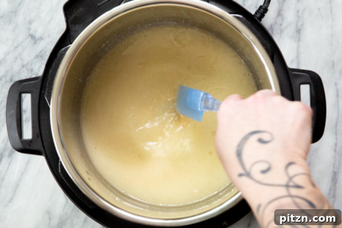 Various ingredients for vegan cheese sauce being mixed together in an Instant Pot before cooking.