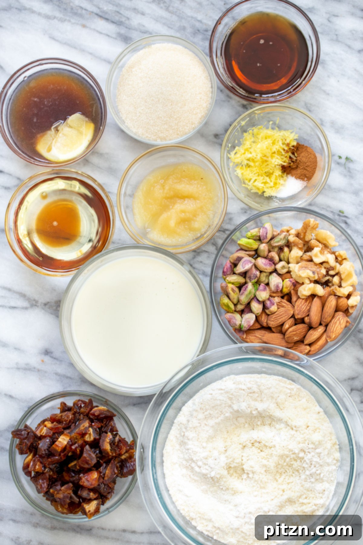 A beautiful spread of ingredients for making baklava cake on a marble countertop, ready for preparation.