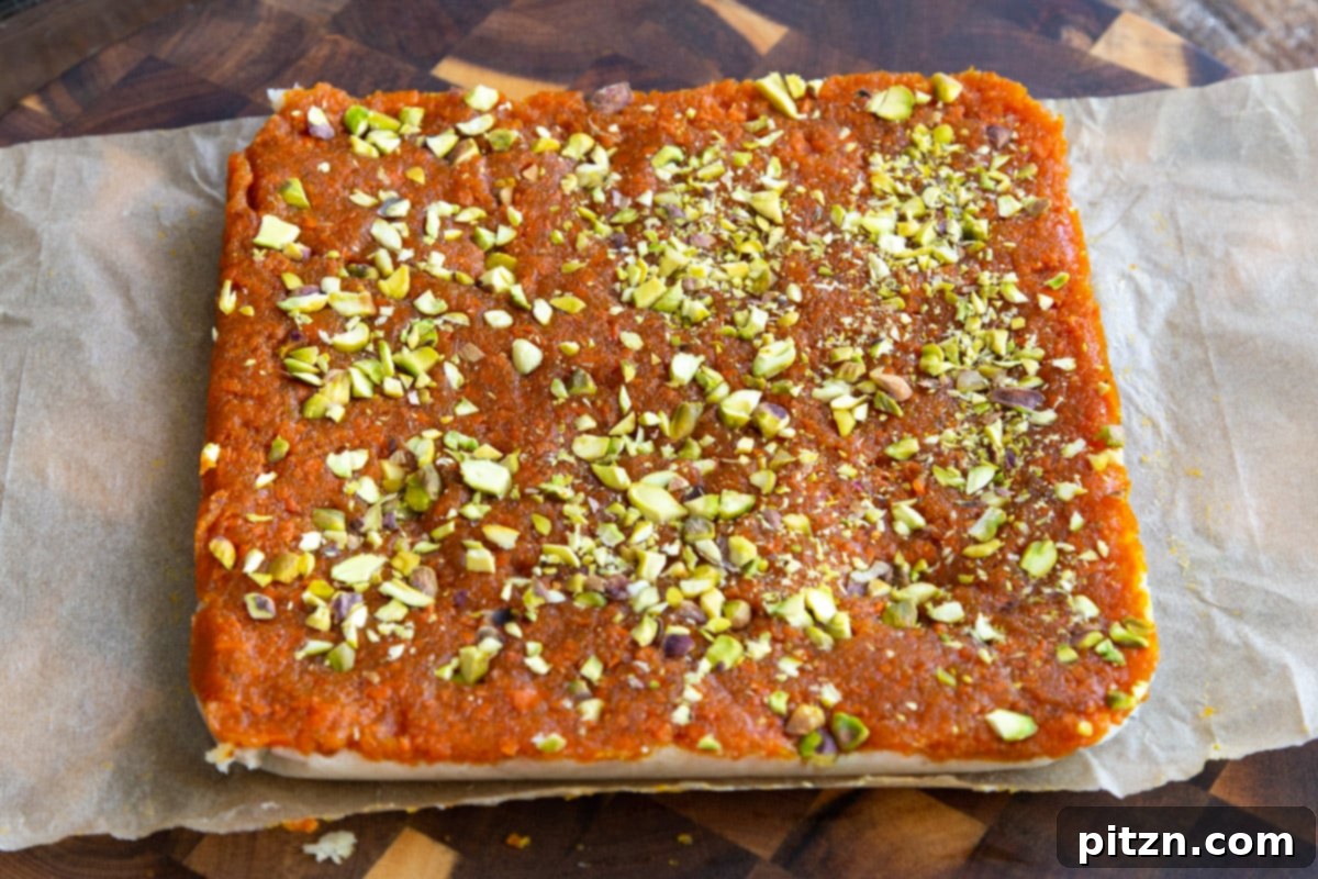 Layered Vegan Carrot Halwa Coconut Burfi 21 coconut burfi carrot halwa bars topped with pistachios