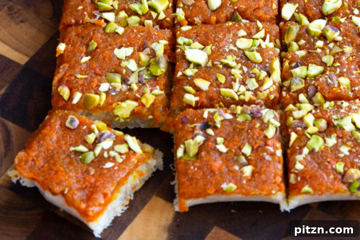 Layered Vegan Carrot Halwa Coconut Burfi 22 layered carrot halwa coconut burfu bars topped with chopped pistachios