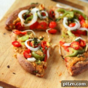 The pizza toppings have indian flavors with the Chana masala Spice hummus, some grated fresh ginger and cilantro garnish. A delicious vegan meal.