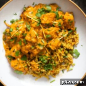 Creamy Vegan Lasooni Tofu Curry, garnished with fresh herbs.