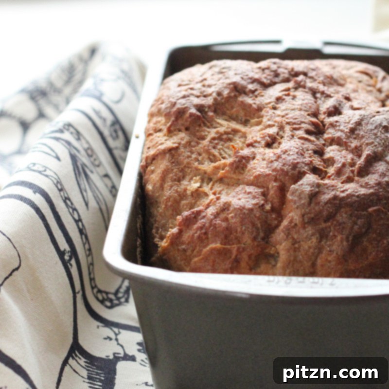Simple No-Knead Vegan Strawberry Wheat Bread 3 Close-up of the crust and tender crumb of the No-Knead Strawberry Wheat Bread, highlighting its appealing texture.