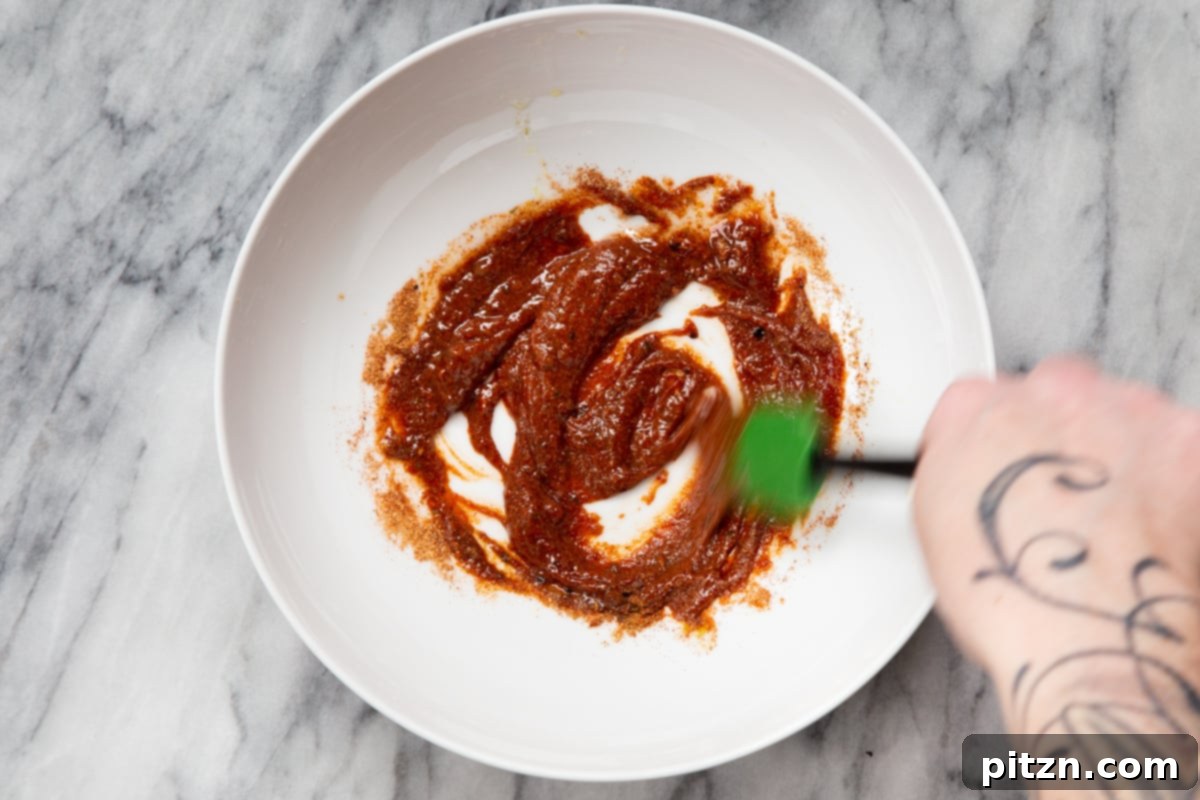 Quick & Easy Vegan Jackfruit Tacos 11 spice paste being mixed in a small bowl