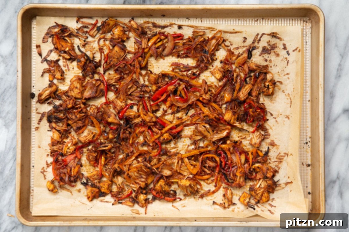 Quick & Easy Vegan Jackfruit Tacos 15 baked marinated jackfruit on a baking sheet