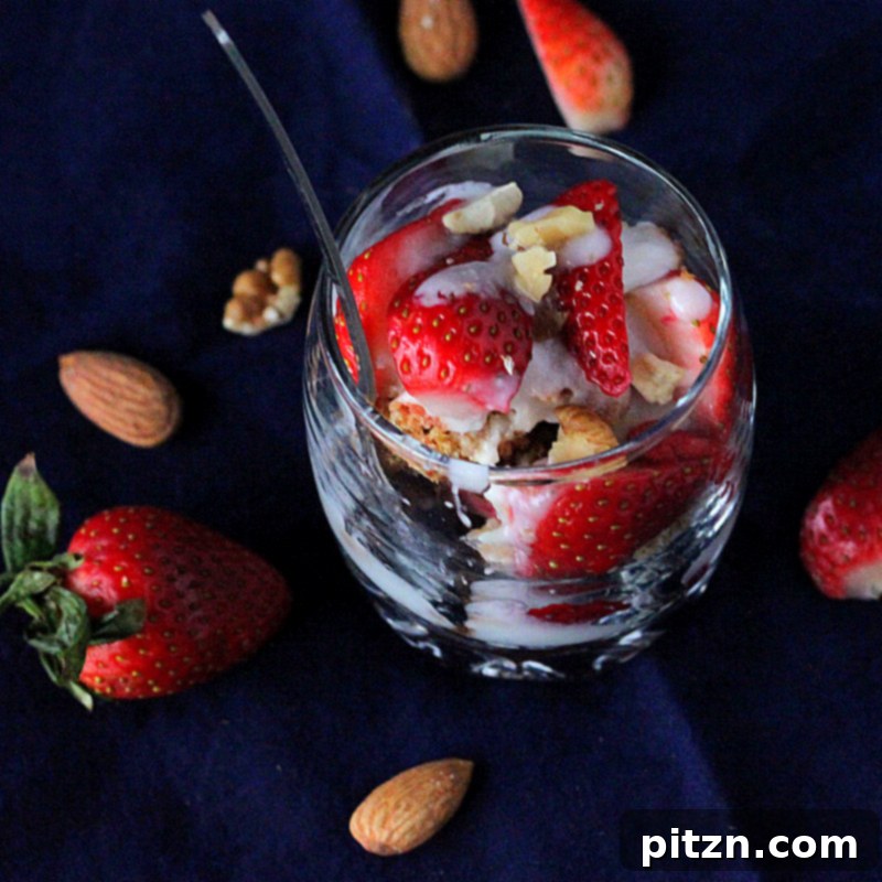 Vegan Gluten-Free Gum-Free Spiced Oat Almond Cake Parfait with Strawberry, Nuts & Goji Berries 4 Three glass parfaits with alternating layers of spiced oat almond gluten-free cake, pink cake, berries, and creamy vegan yogurt, showcasing the beautiful presentation