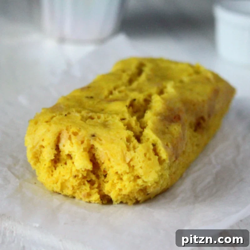 Close-up of fluffy Khaman Dhokla pieces with green chilies