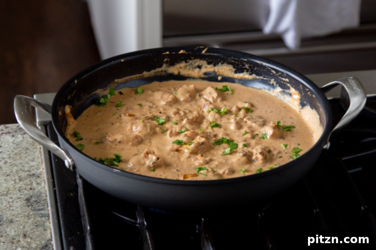 Creamy Fenugreek Tofu and Chickpea Curry 22 Garnished proteins in the pan, tossed in the curry sauce with fresh cilantro and pepper flakes, ready to serve
