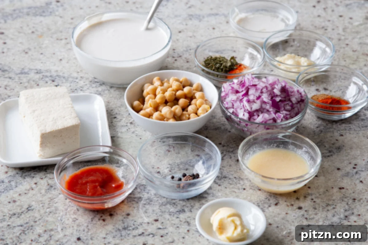 Creamy Fenugreek Tofu and Chickpea Curry 5 Bowls of various fresh ingredients for Kasuri Malai Murg laid out on a kitchen countertop