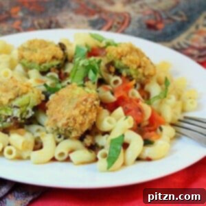 Breaded Brussels sprouts served on top of a plate of pasta with tomato basil sauce
