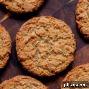 Beautifully baked vegan lemon poppyseed cookies, showcasing a perfect golden brown, ready to be enjoyed.