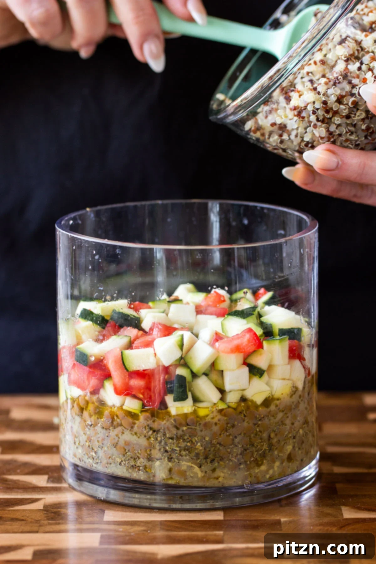 Effortless Lentil Quinoa Medley 5 A bowl of cooked quinoa, part of the ingredients for the layered lentil quinoa salad.