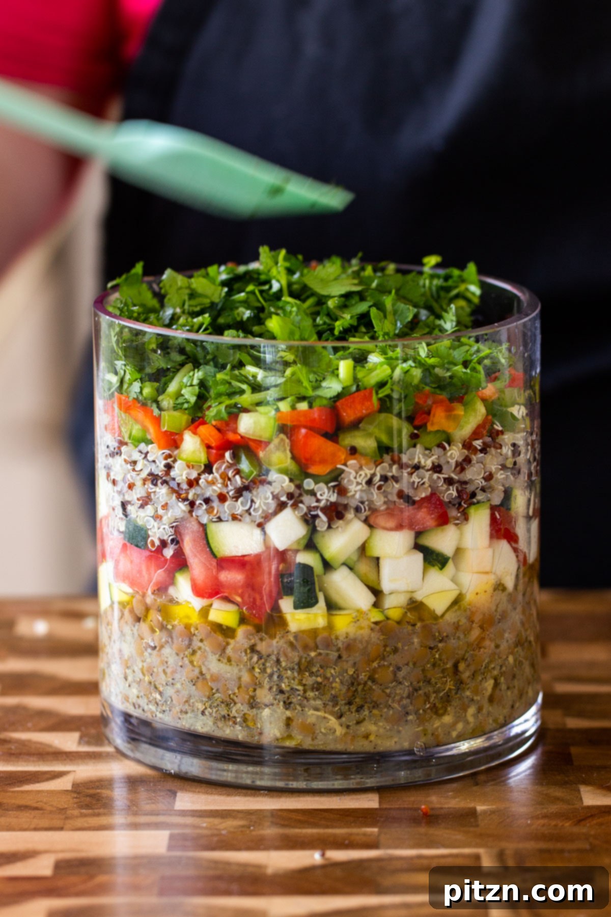 Effortless Lentil Quinoa Medley 8 Freshly chopped cilantro creating a bright green layer in the salad jar, enhancing both flavor and visual appeal.