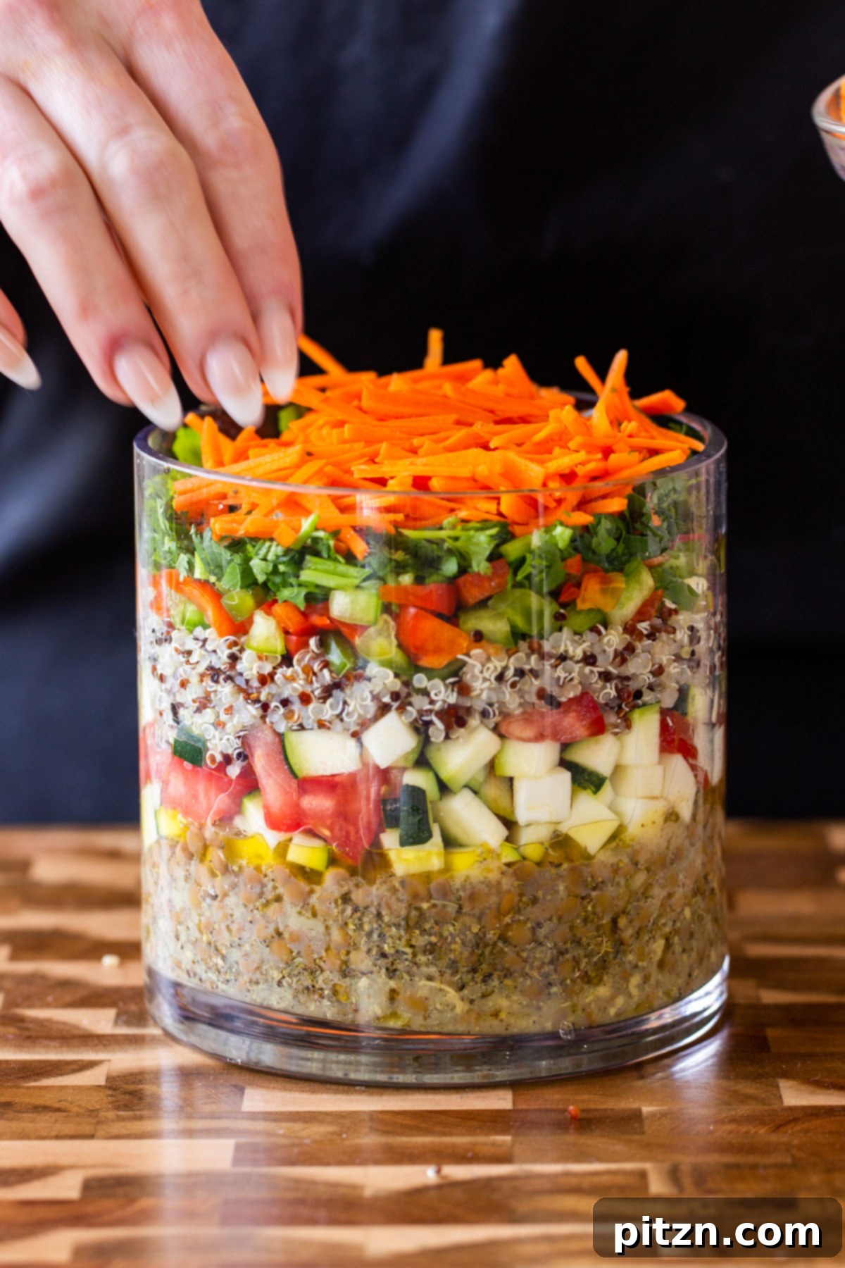 Effortless Lentil Quinoa Medley 9 Shredded carrots creating a vibrant orange layer in the salad jar, contributing sweetness and a satisfying crunch.