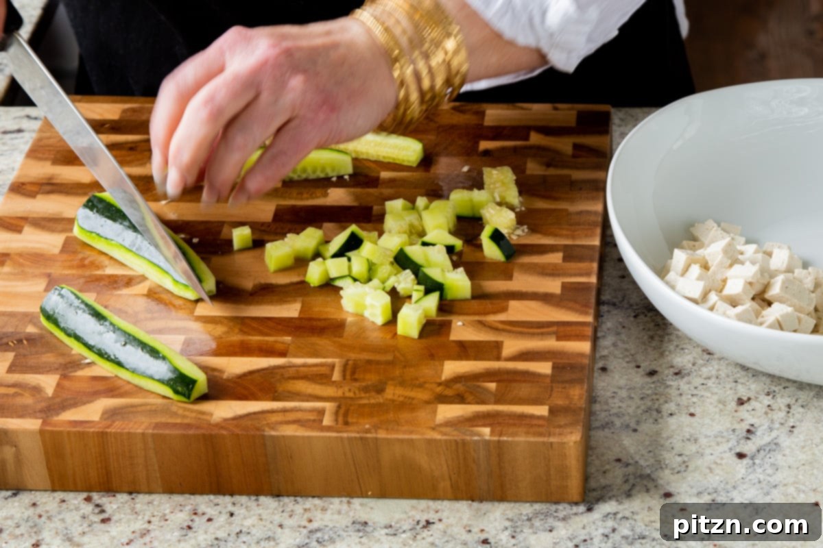 Wholesome Chaat Masala Chopped Salad 11 chopping the cucumber