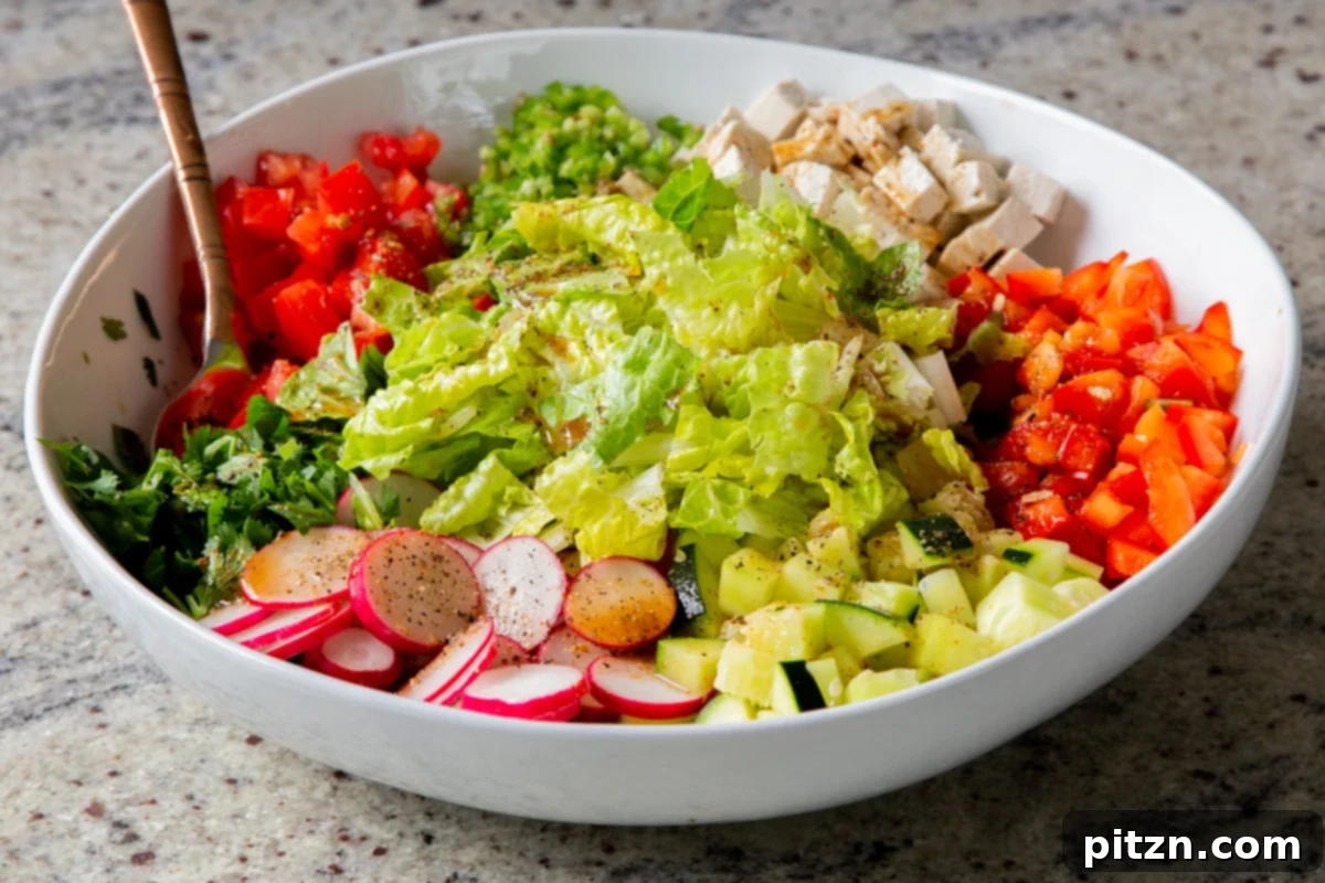 Wholesome Chaat Masala Chopped Salad 14 tofu, cilantro, and veggies in the mixing bowl before mixing