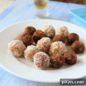Beautifully arranged Coconut Almond Rum Balls, garnished for a festive look.