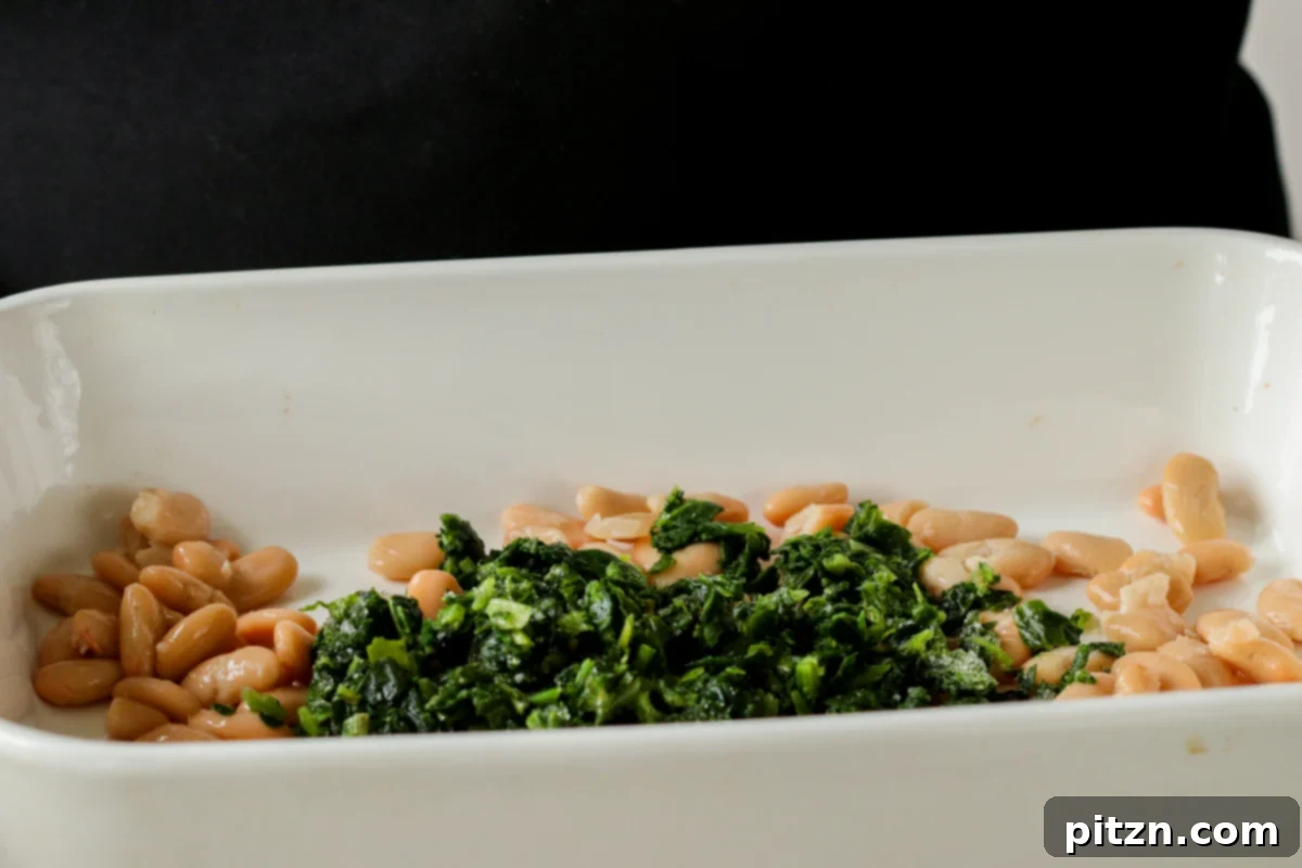 Comforting Delicata Squash and White Bean Casserole 16 spinach and white beans in the casserole dish