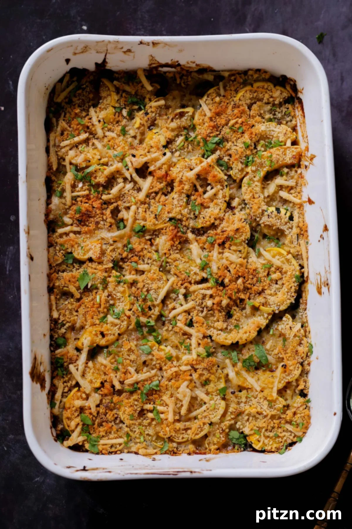 Comforting Delicata Squash and White Bean Casserole 3 delicata squash casserole in the baking pan after baking