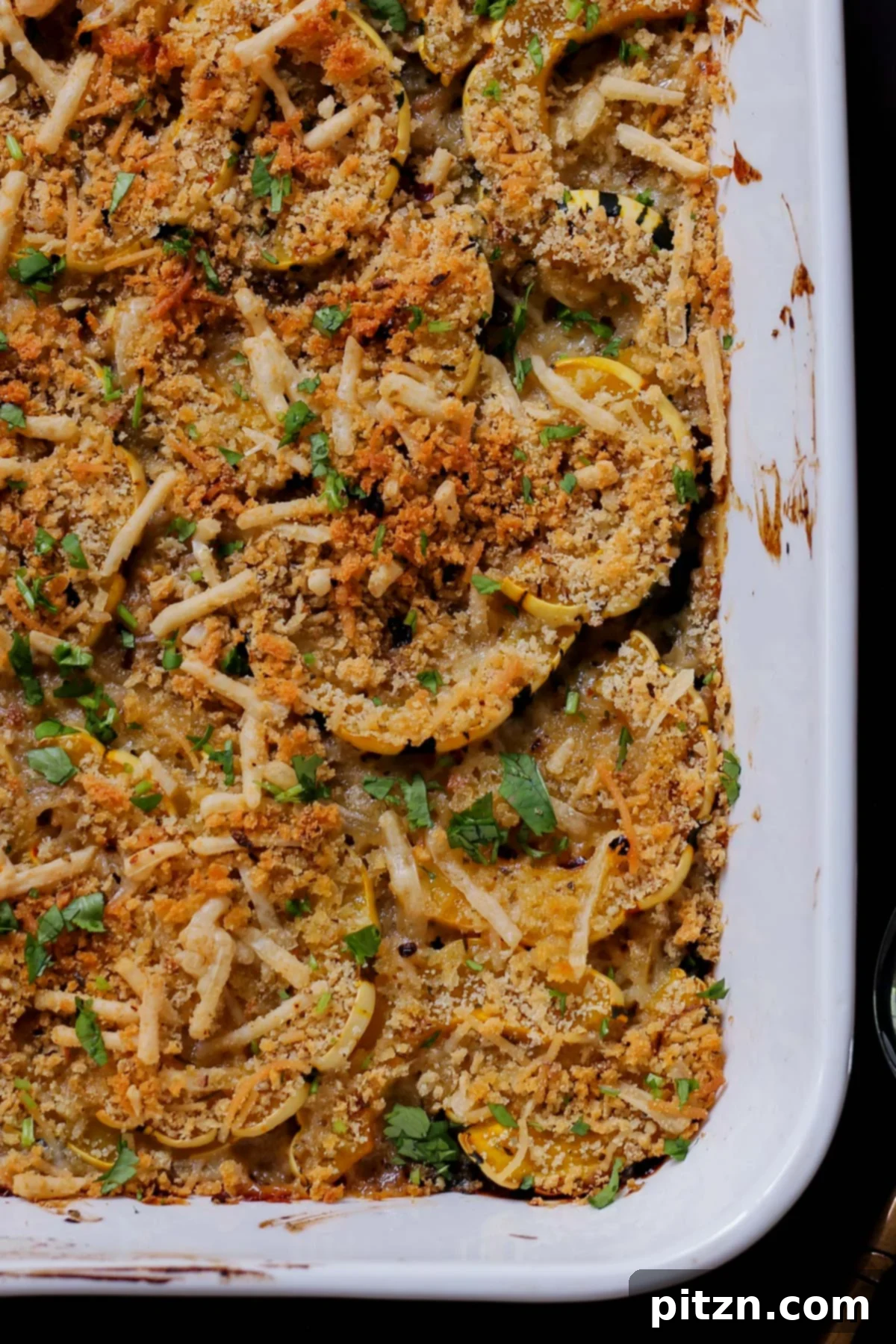 Comforting Delicata Squash and White Bean Casserole 4 close-up of delicata squash casserole in the baking pan after baking
