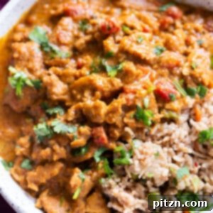 A vibrant Instant Pot Vegan Coconut Chicken Curry featuring soy curls, showcasing a creamy texture and rich spices.