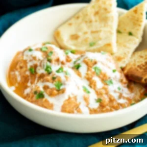 A bubbling Shahi Tofu Kofta Casserole, showcasing creamy sauce and baked tofu koftas.