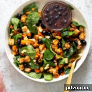 Two vibrant bowls of spicy maple mustard tofu with roasted sweet potatoes, highlighting a wholesome and flavorful meal.