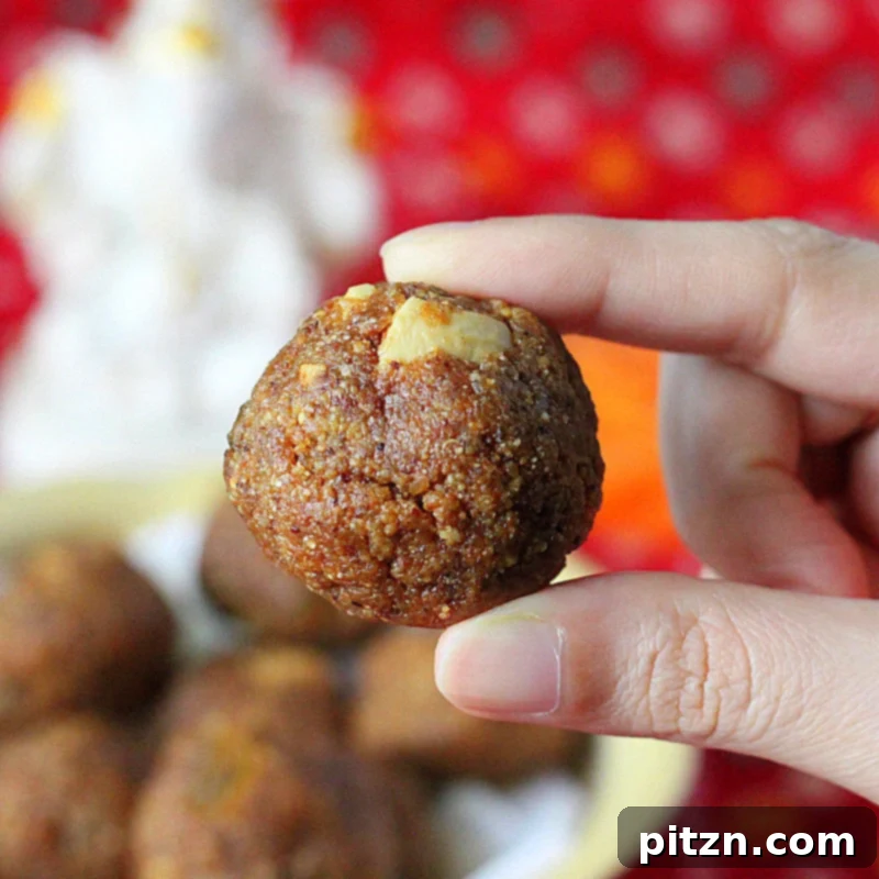 Vegan Indian Besan Laddoo Sweet Chickpea Delight with Cashews and Raisins 5 Close-up of golden brown Besan Laddoo