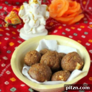 Besan laddoo in a pale bowl on a red background