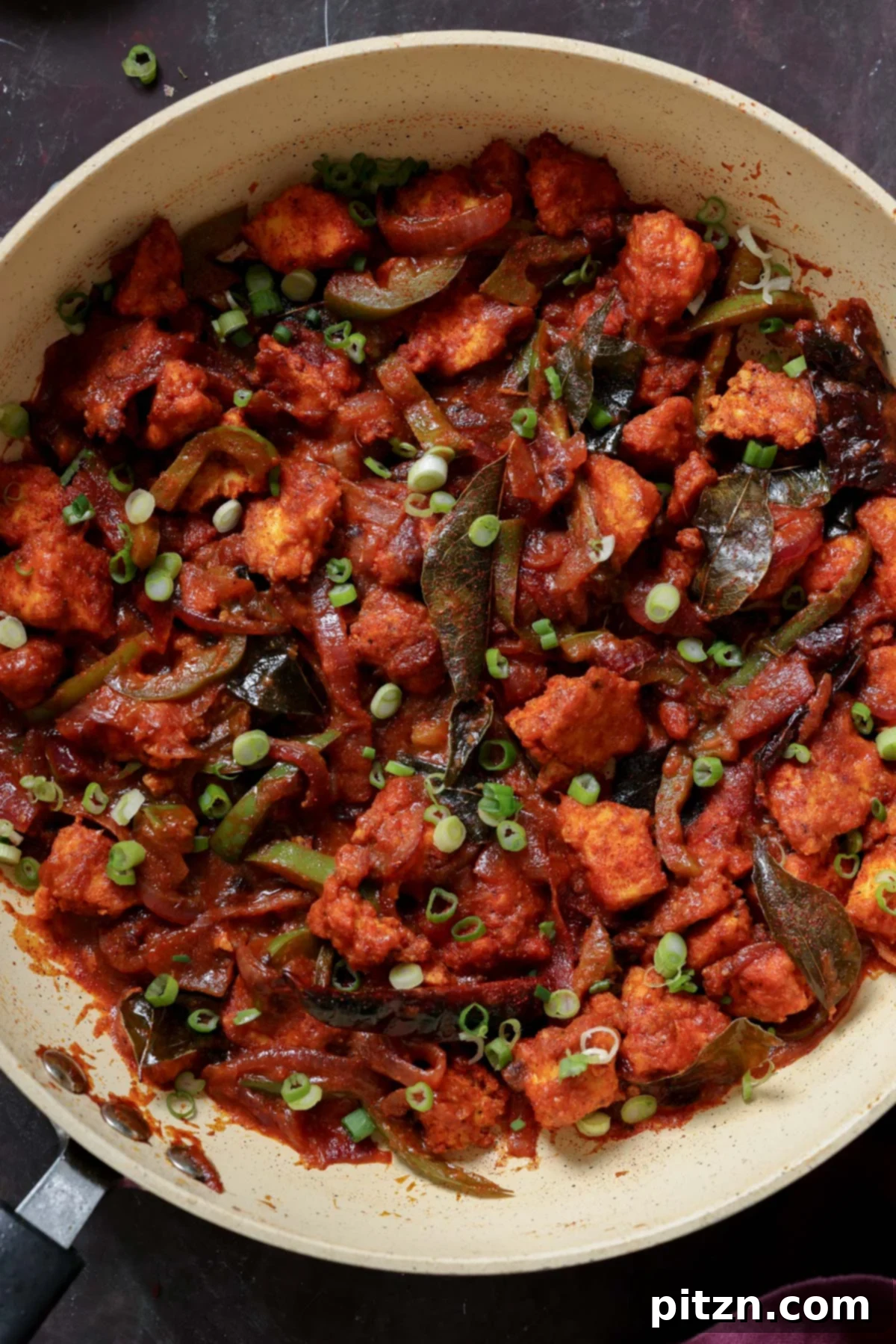 Tofu Kondattam: Crispy & Spicy South Indian Tofu 2 Crispy Tofu Kondattam in a pan, garnished and ready to serve