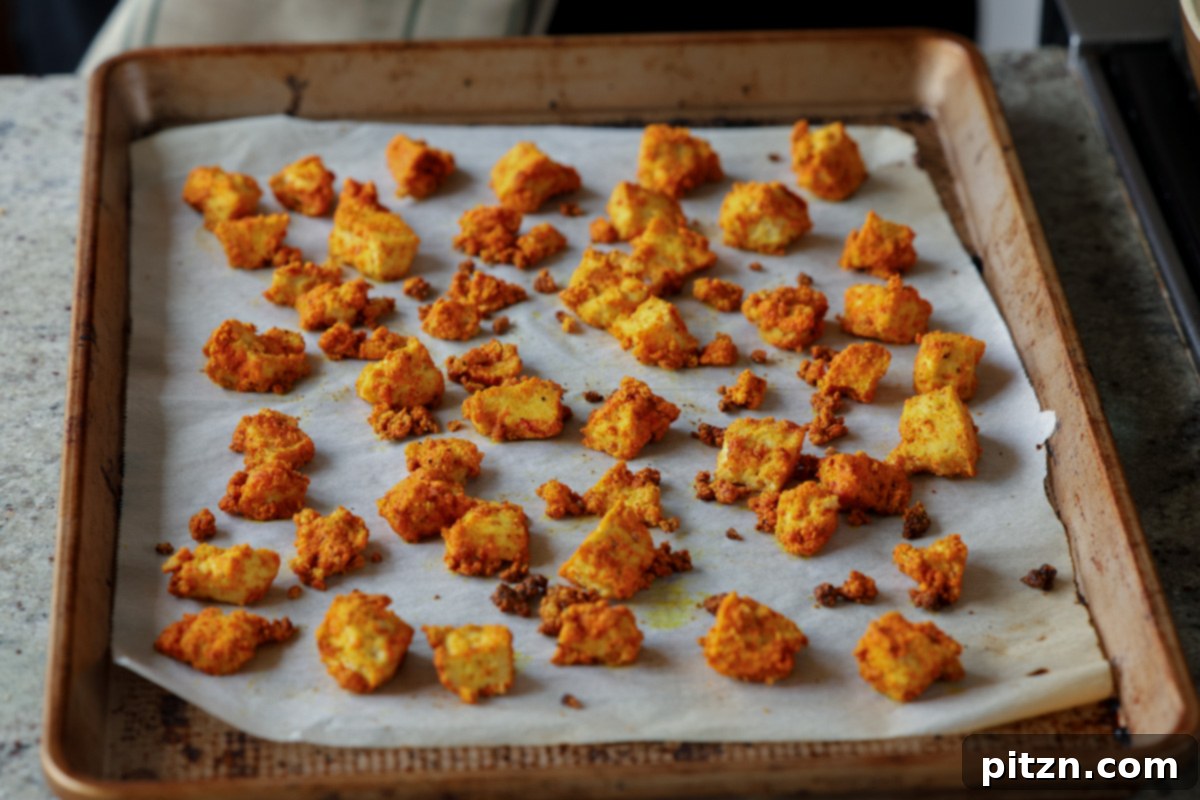 Tofu Kondattam: Crispy & Spicy South Indian Tofu 13 Baked tofu on the baking sheet, golden and crispy after cooking