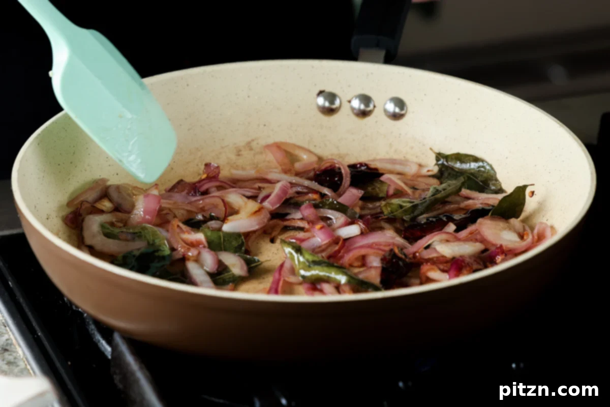 Tofu Kondattam: Crispy & Spicy South Indian Tofu 16 Sautéed onions in the pan, lightly caramelized and softened
