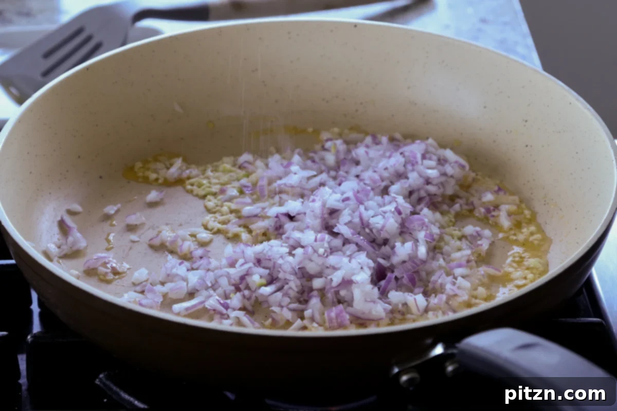 Vegan Marry Me Chicken Pasta 13 Chopped onions added to the skillet with garlic