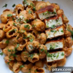 Marry Me Pasta on a white plate with seared tofu pieces