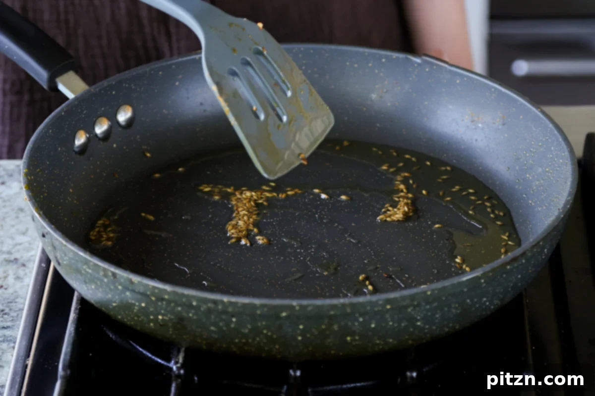 North Indian Smoky Rara Chicken Curry 17 toasting cumin seeds