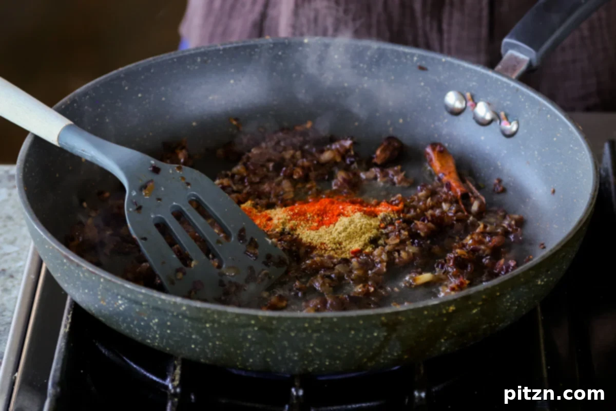 North Indian Smoky Rara Chicken Curry 21 adding ground spices to the onion