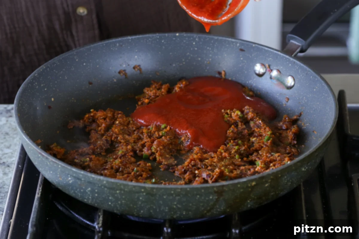 North Indian Smoky Rara Chicken Curry 23 adding tomato puree