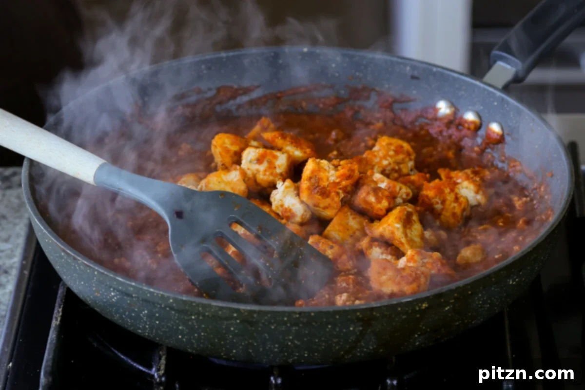 North Indian Smoky Rara Chicken Curry 27 adding the tofu into the rara chicken curry sauce