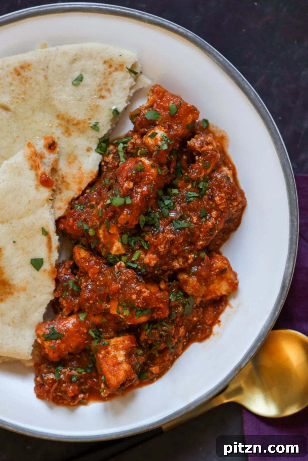 North Indian Smoky Rara Chicken Curry 5 rara chicken curry on a plate with flatbread