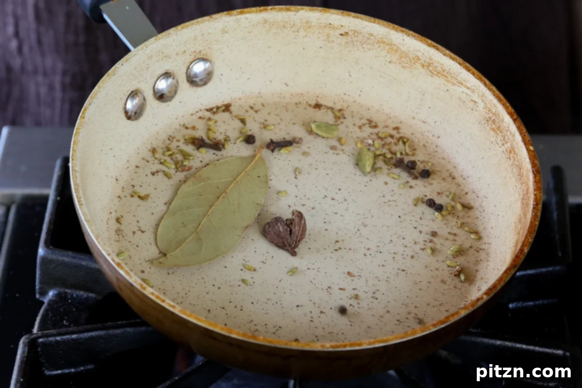 North Indian Smoky Rara Chicken Curry 8 toasting whole spices in the pan