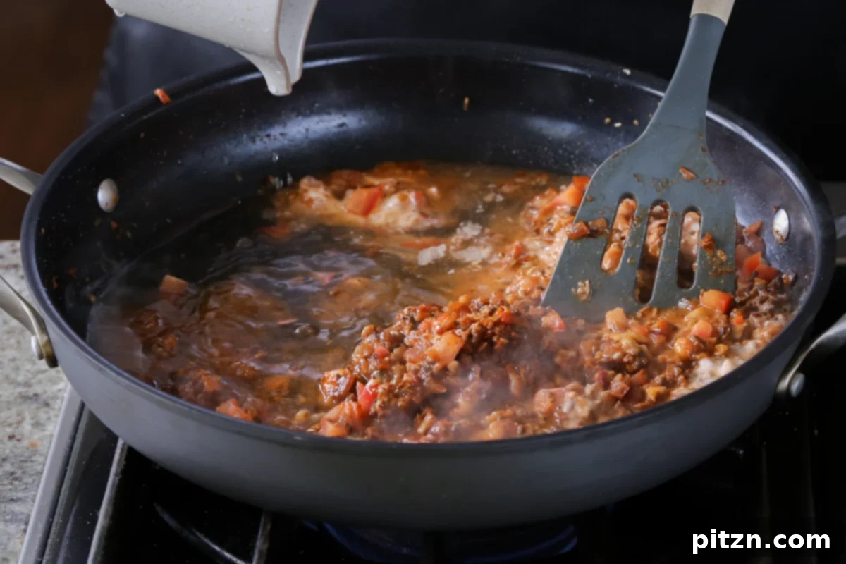 Weeknight Skillet Sausage and White Bean Pasta 16 The tomato and non-dairy cream mixture blended smoothly into the vegan sausage base, creating a rich and vibrant pasta sauce.