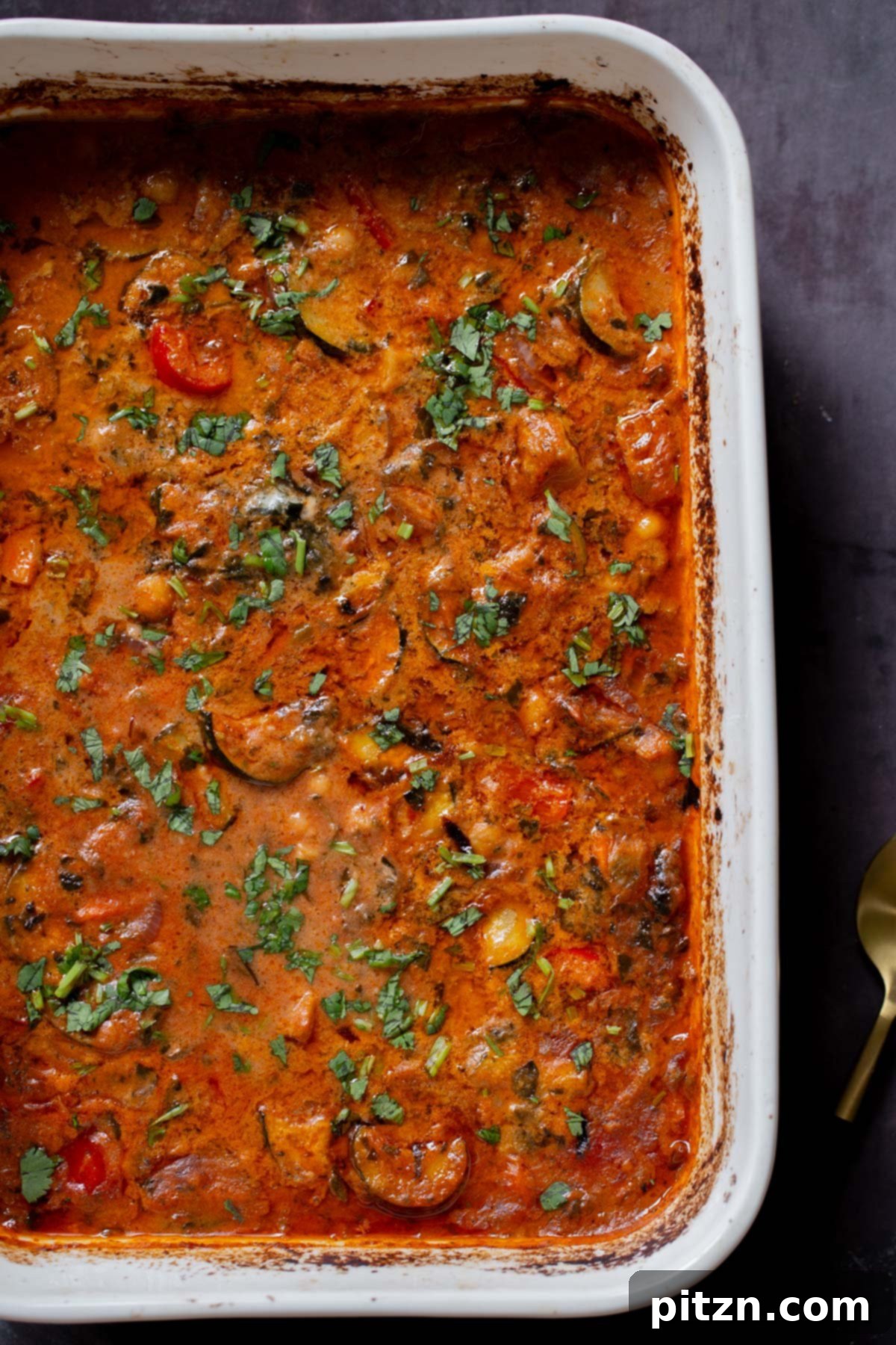 Spicy Golden Baked Zucchini Chickpea Curry Allergen Free 3 Freshly baked zucchini chickpea curry bubbling in a baking pan, straight out of the oven.