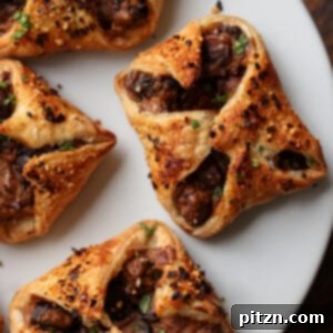 Mushroom puffs on a white serving plate, ready to be enjoyed.